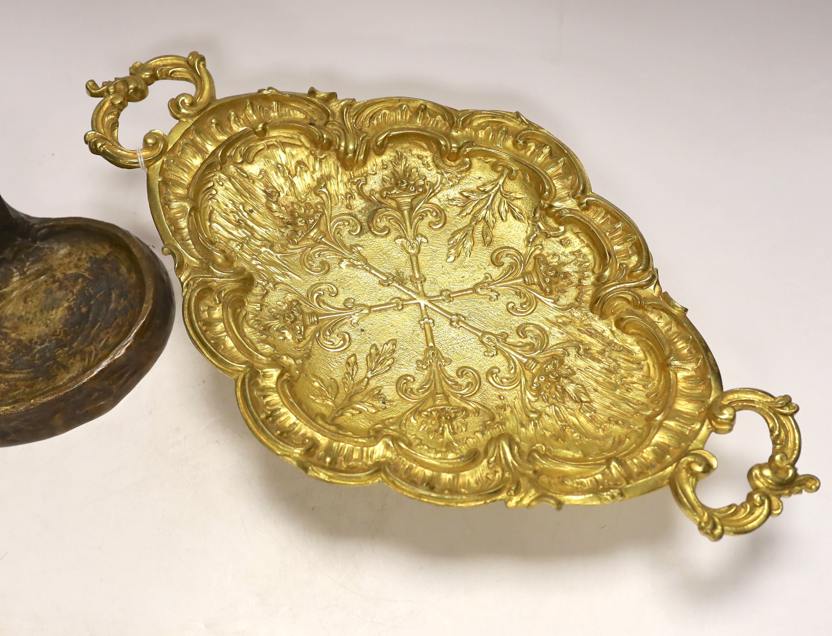 A gilt metal oval dish with twin handles and match tray, 43cm wide